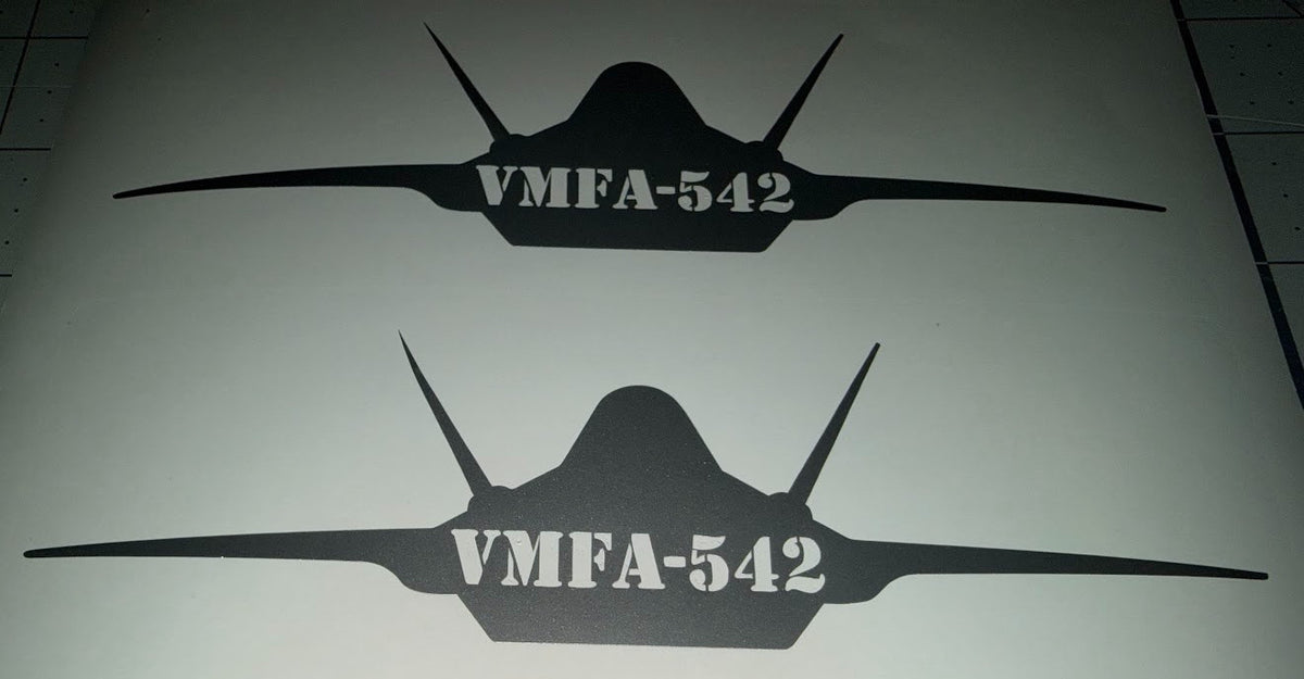 Silver F-35 decal with VMFA-542 cut into the jet, applied to a window
